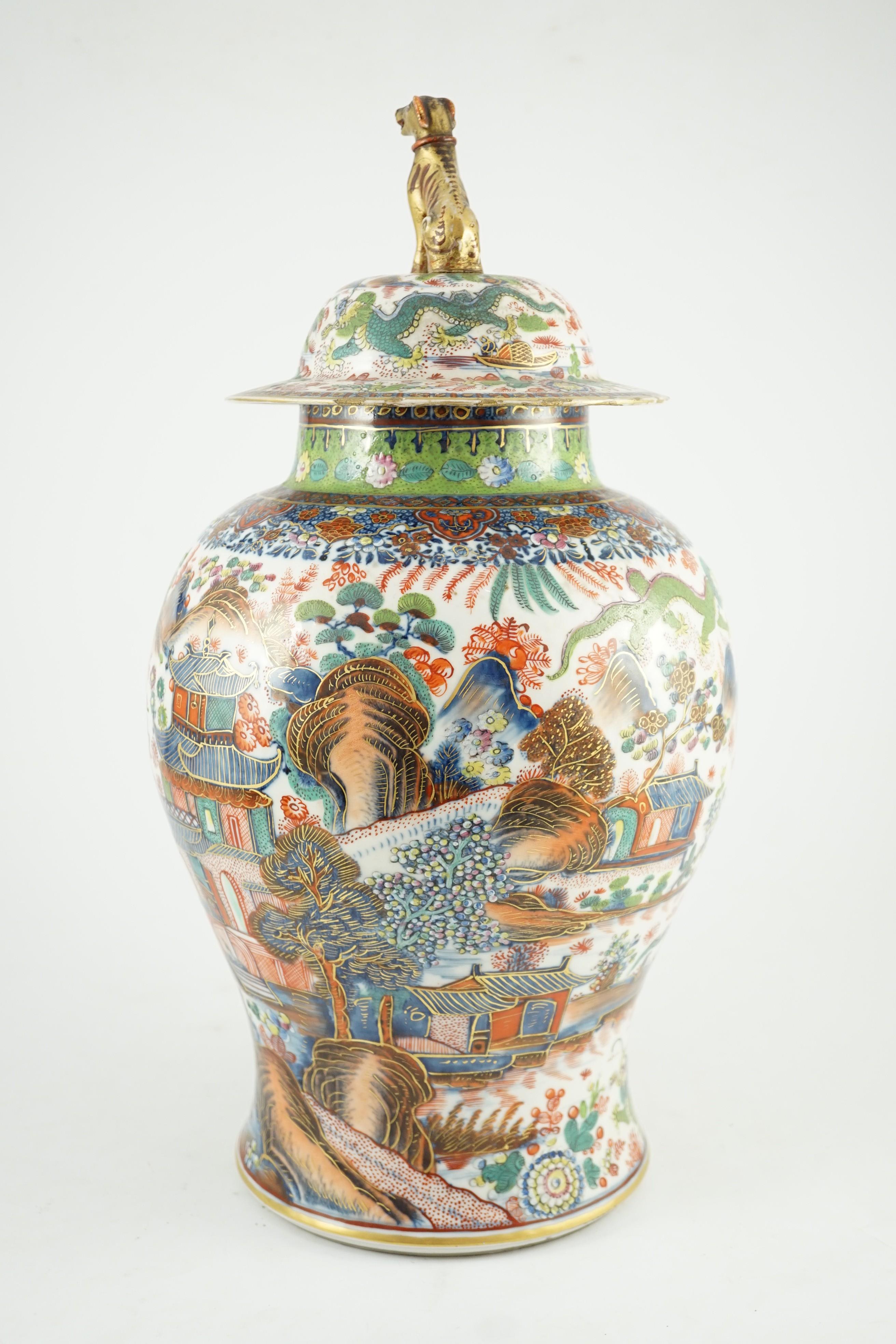 A Chinese clobbered blue and white vase and cover, 18th/19th century, 47cm high
